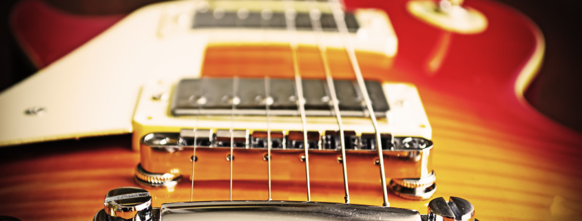 close up of an electric guitar bridge in vintage effect