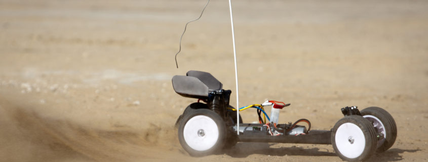Remote control car running on sand