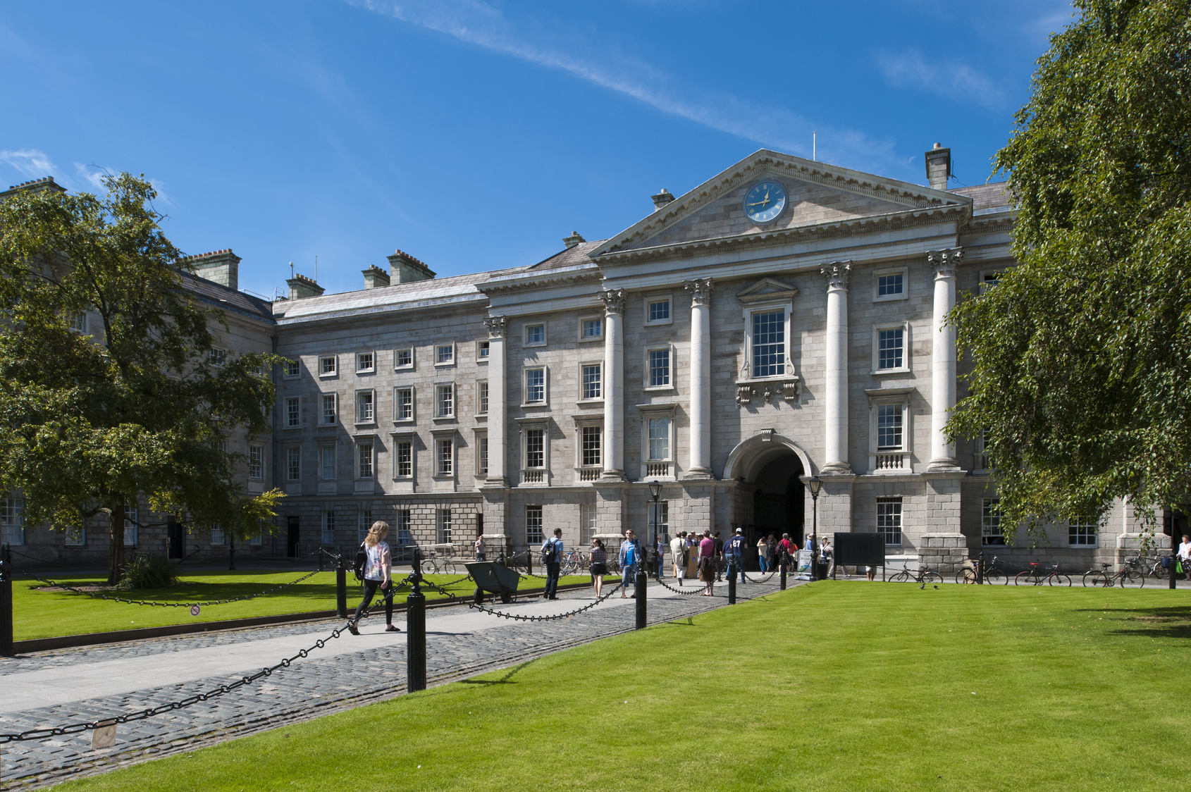 People walking through the grounds of Trinity College, Dublin, Ireland which was founded by Elizabeth 1 in 1592