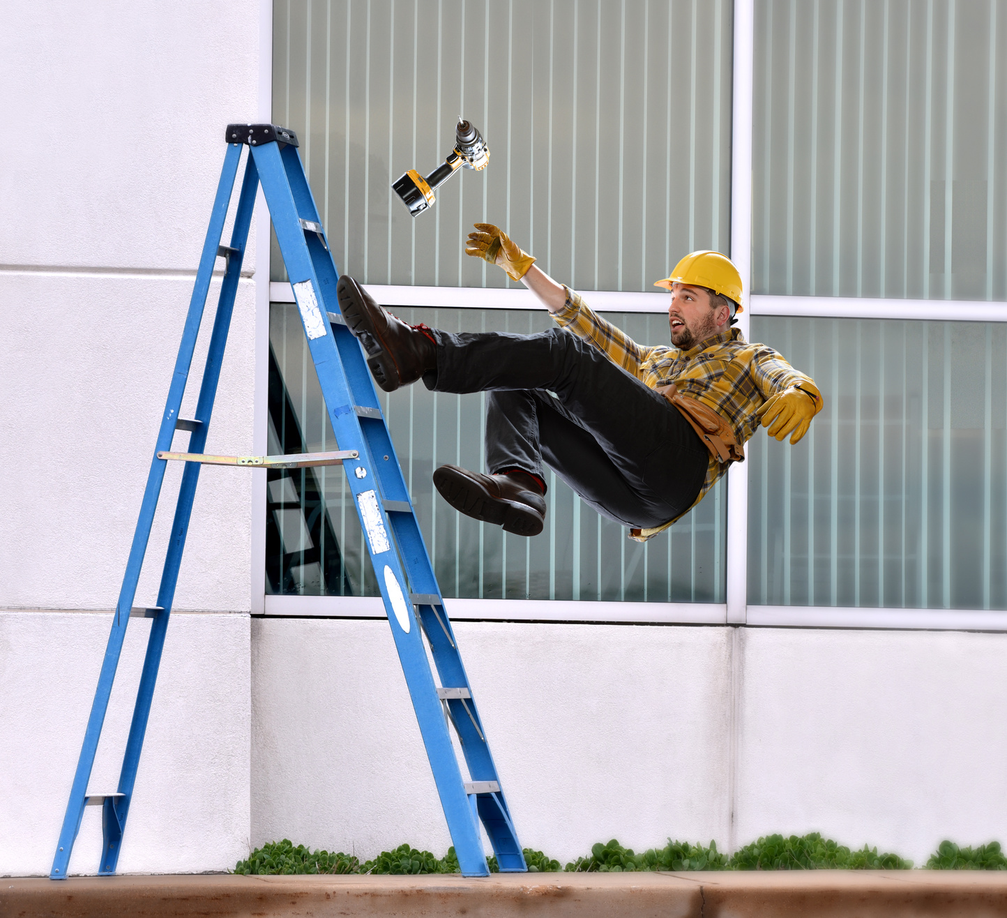 A worker falls from ladder while making repairs to building