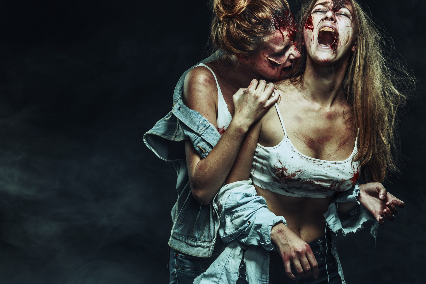 Two Scary zombie women with wounds on Halloween holidays.