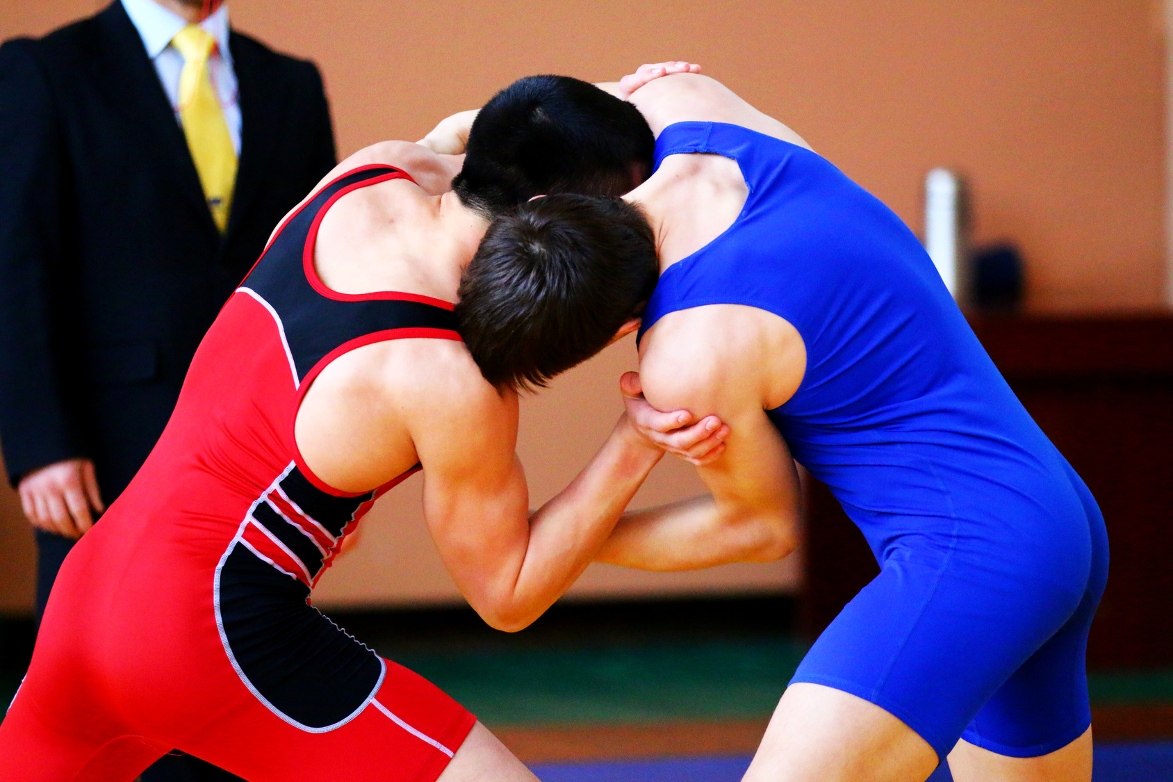 Greco-Roman wrestlers in competition